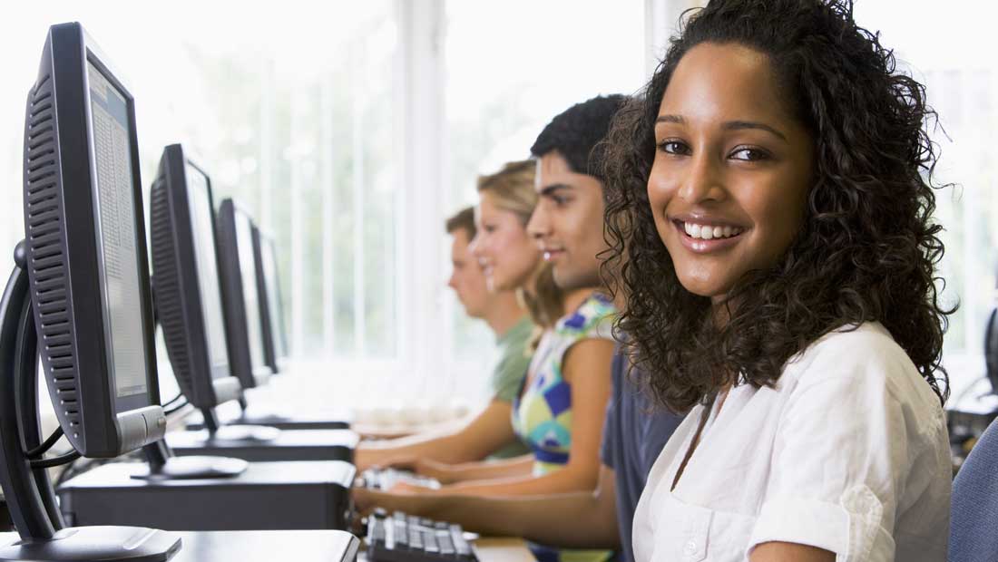 Students looking at computer monitors