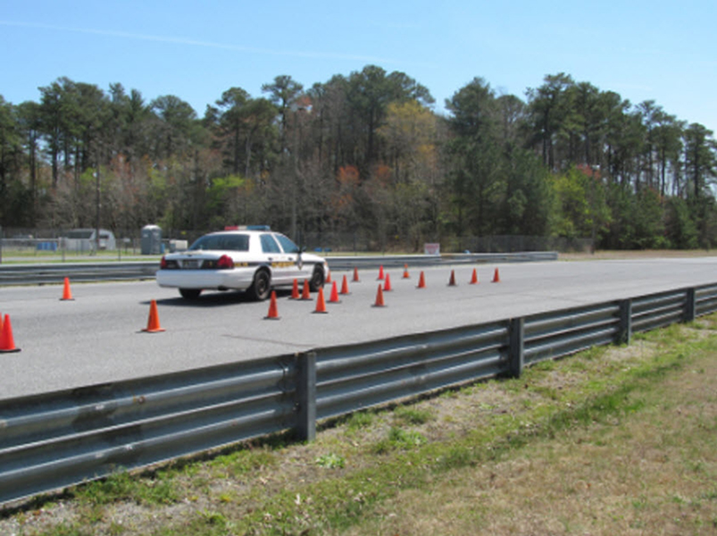 Police car maneuvering on road