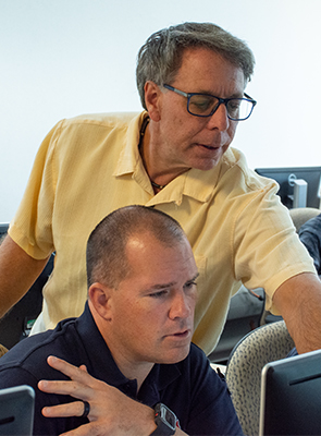 instructor helping student