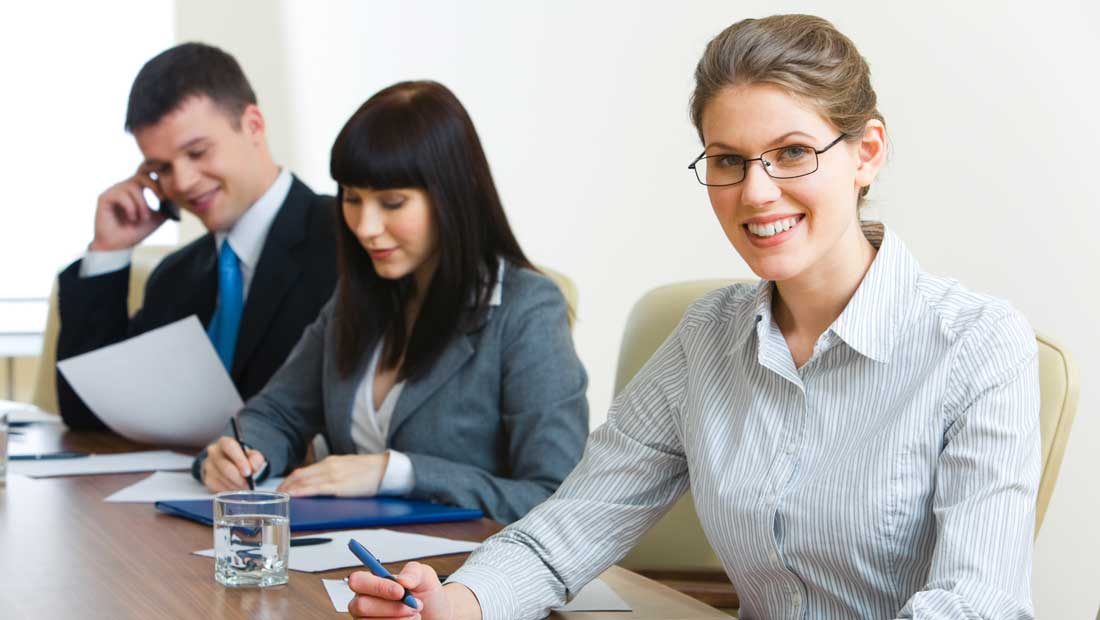Three people sitting at a table