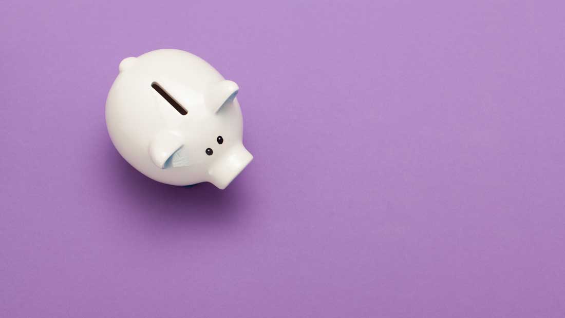 Pink Piggy Bank on purple background