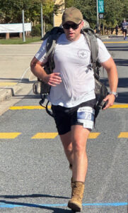man running with pack