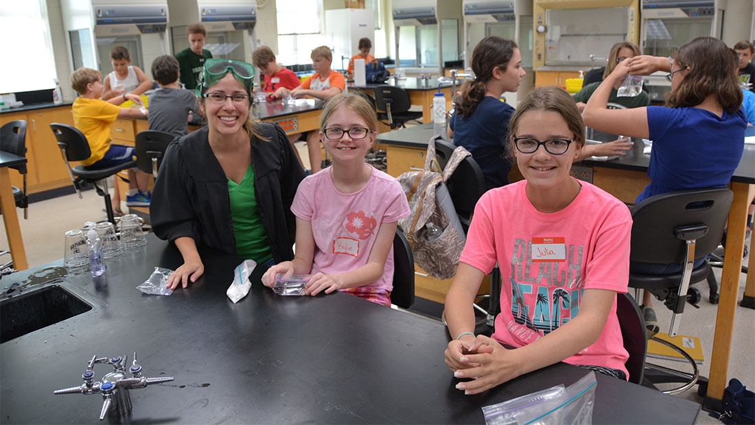 Children with an adult in a lab